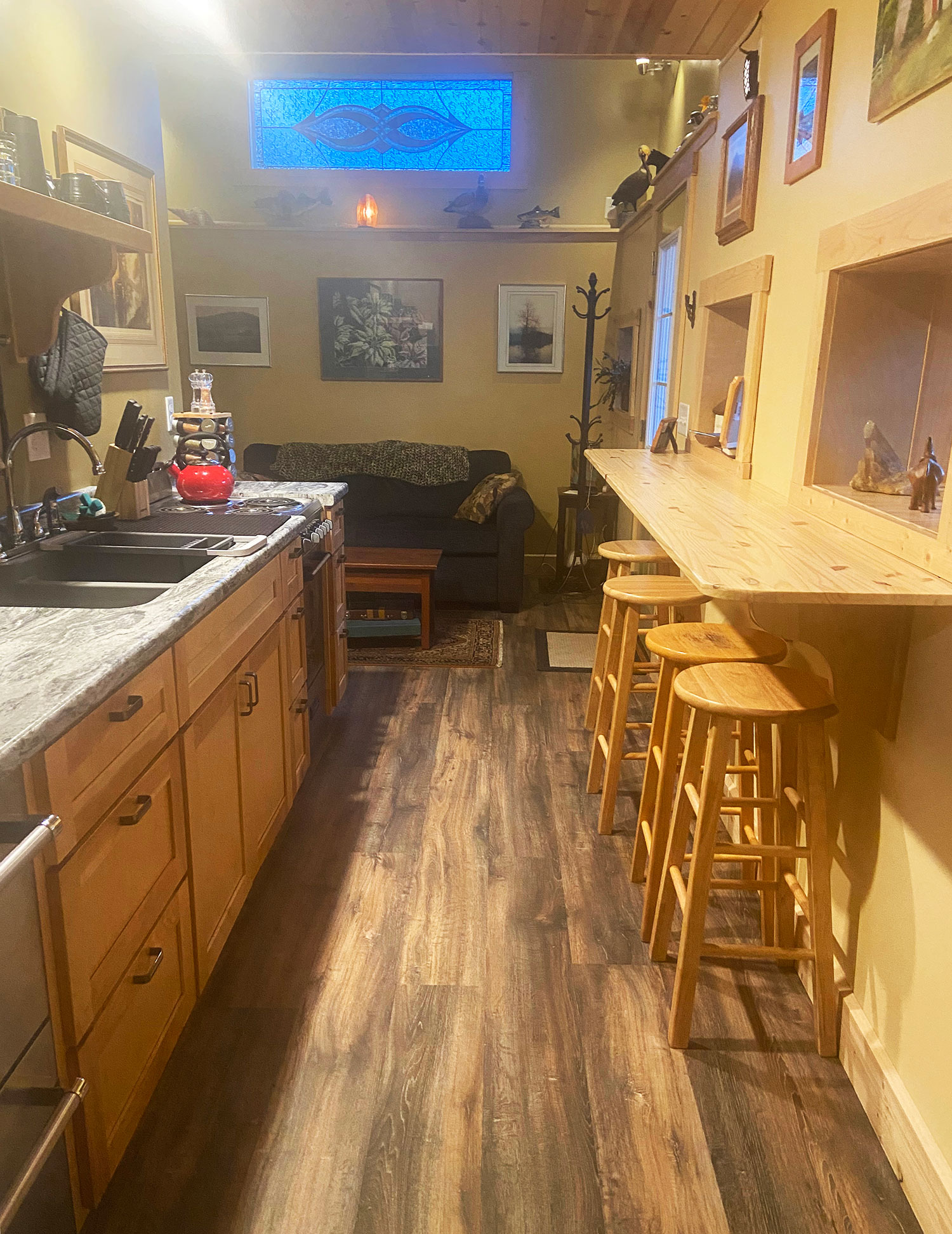 Kitchen view to sleeper sofa in living room